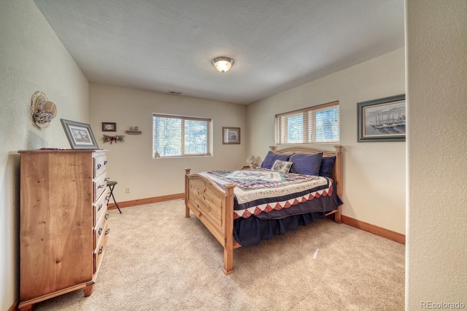 30800 West Ridge Road Buena Vista, CO 81211 - Photo 22 of 49 a bedroom with a bed and window