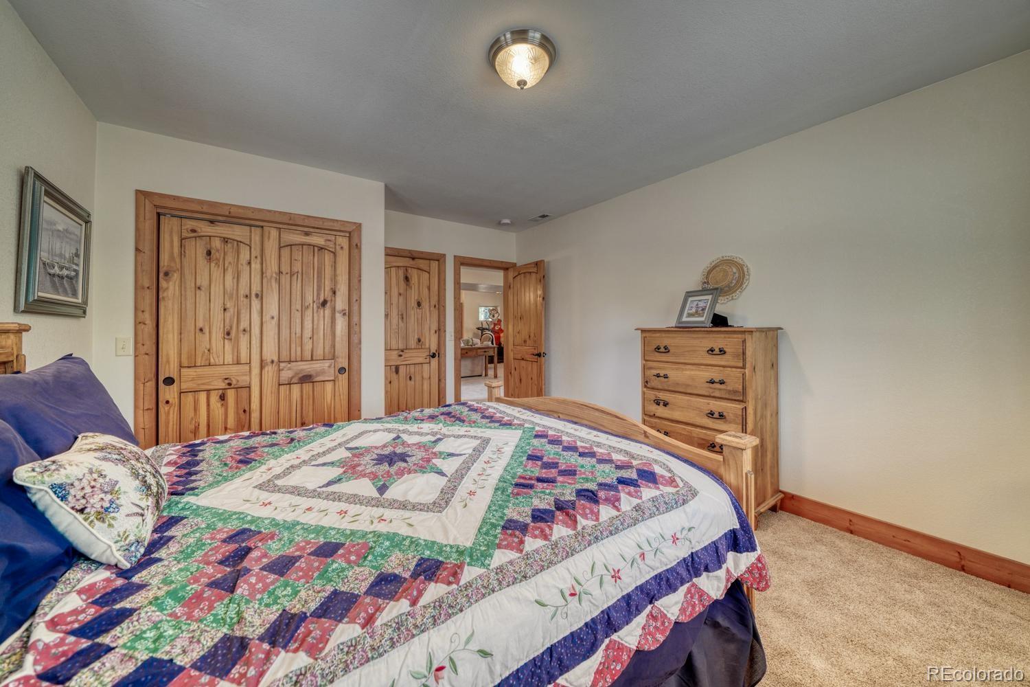 30800 West Ridge Road Buena Vista, CO 81211 - Photo 23 of 49 a bedroom with a bed and a dresser