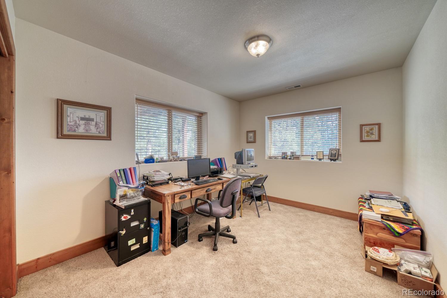 30800 West Ridge Road Buena Vista, CO 81211 - Photo 25 of 49 a view of a workspace with furniture and a window