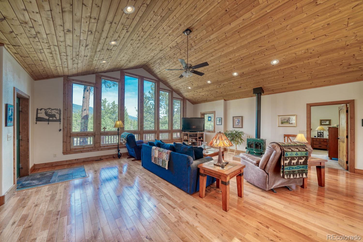 30800 West Ridge Road Buena Vista, CO 81211 - Photo 6 of 49 a living room with furniture a wooden floor and next to a window