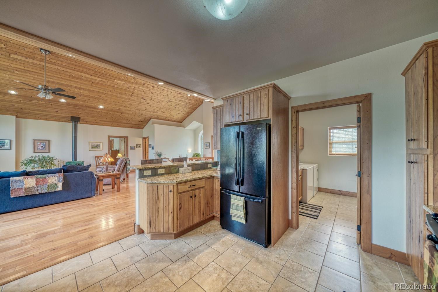 30800 West Ridge Road Buena Vista, CO 81211 - Photo 10 of 49 a kitchen with stainless steel appliances granite countertop a refrigerator and a stove