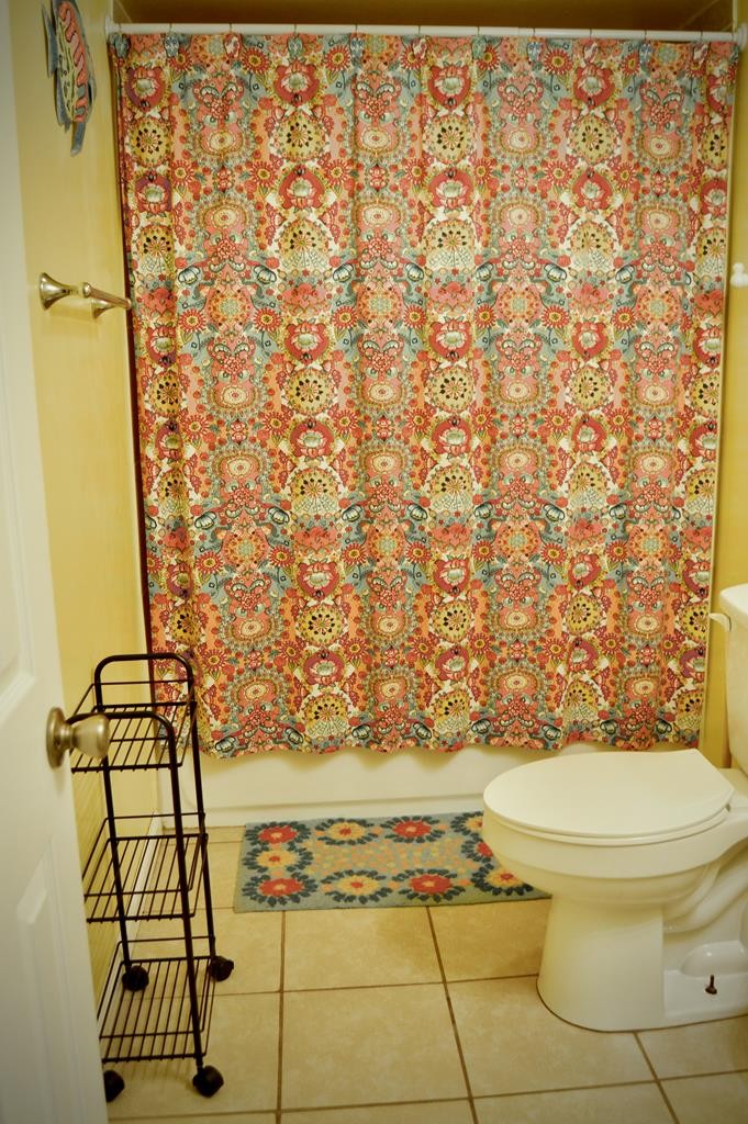 5641 Eastport Road Alpine, TN 38543 - Photo 15 of 15 a bathroom with a toilet and a shower curtain