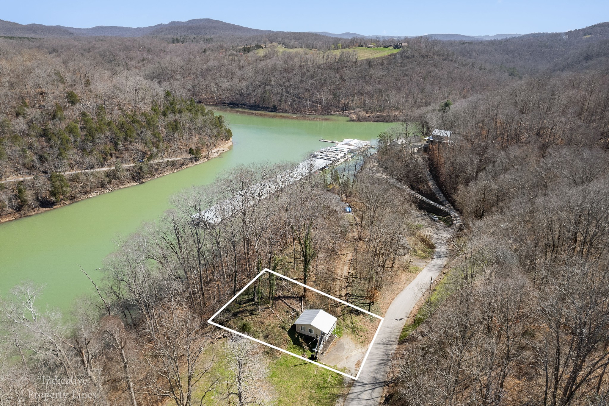 5641 Eastport Road Alpine, TN 38543 - Photo 5 of 15 a view of a lake with a mountain in the background