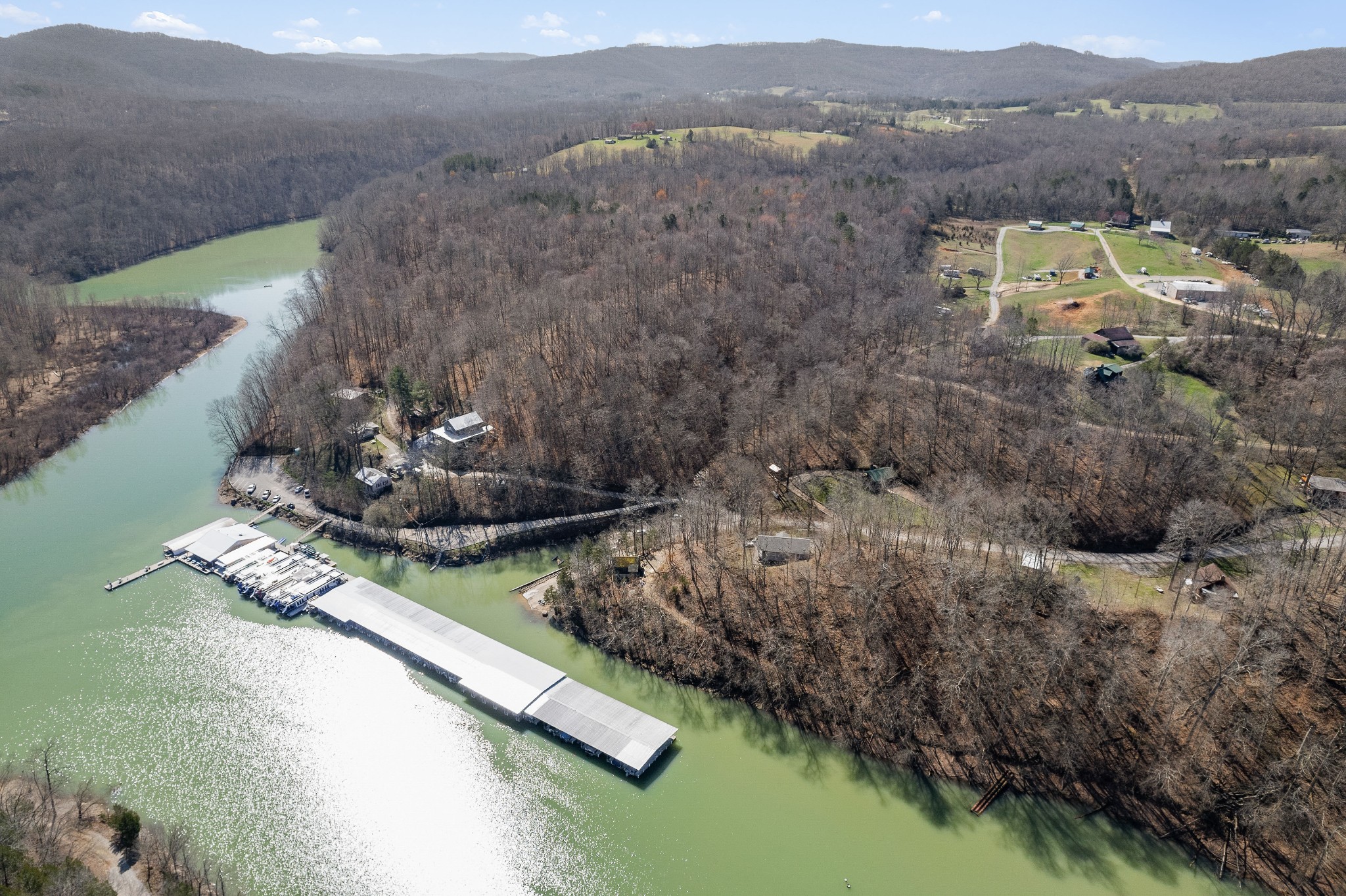 5641 Eastport Road Alpine, TN 38543 - Photo 8 of 15 a view of a lake with a mountain in the background