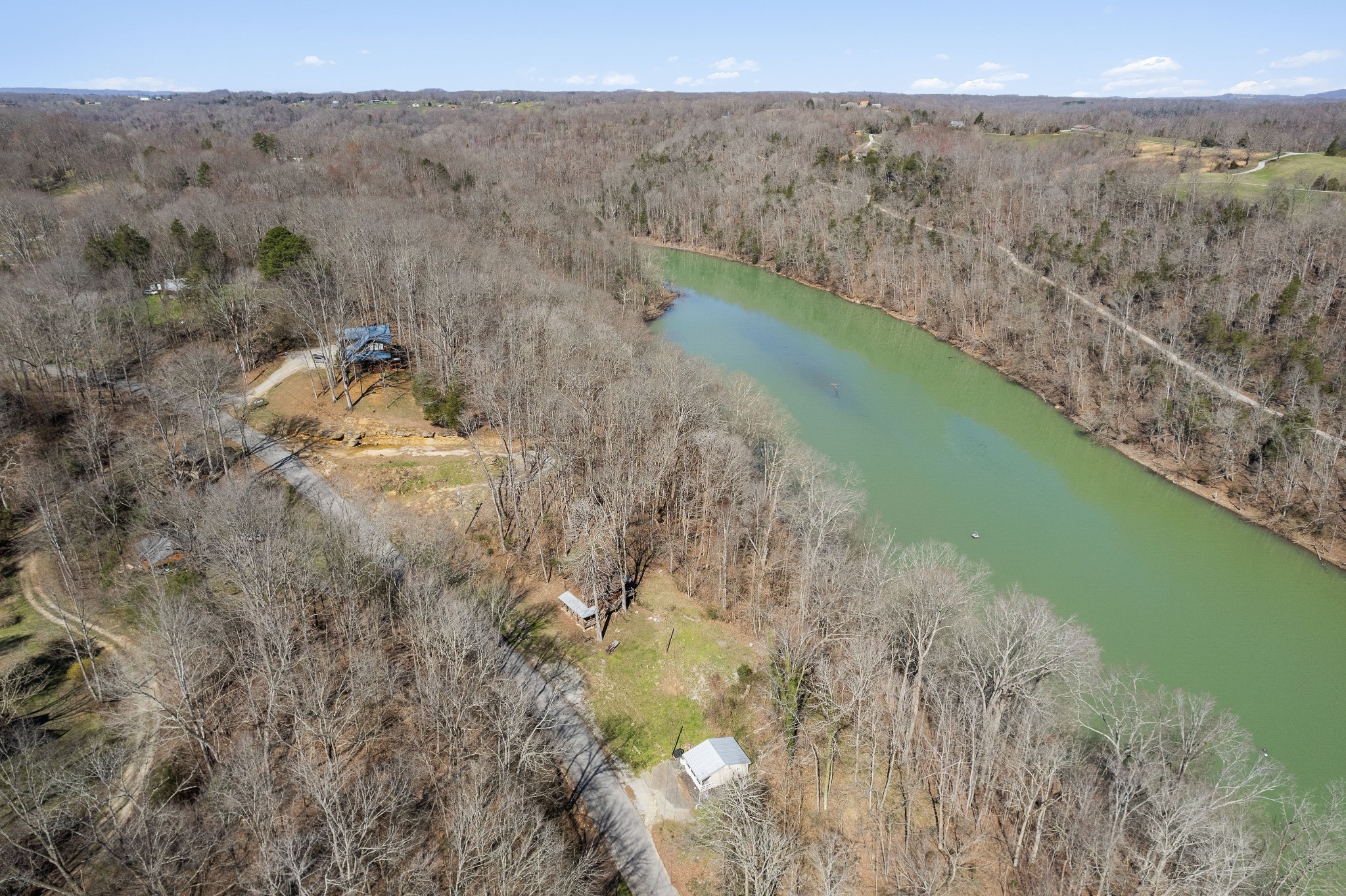 5641 Eastport Road Alpine, TN 38543 - Photo 9 of 15 a view of a lake in middle of the forest