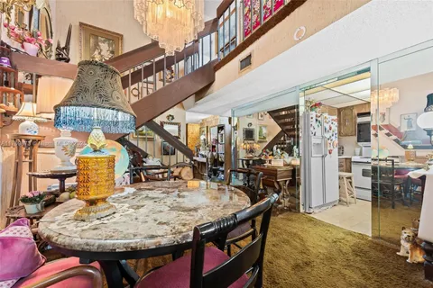 a view of a chairs and table in the patio