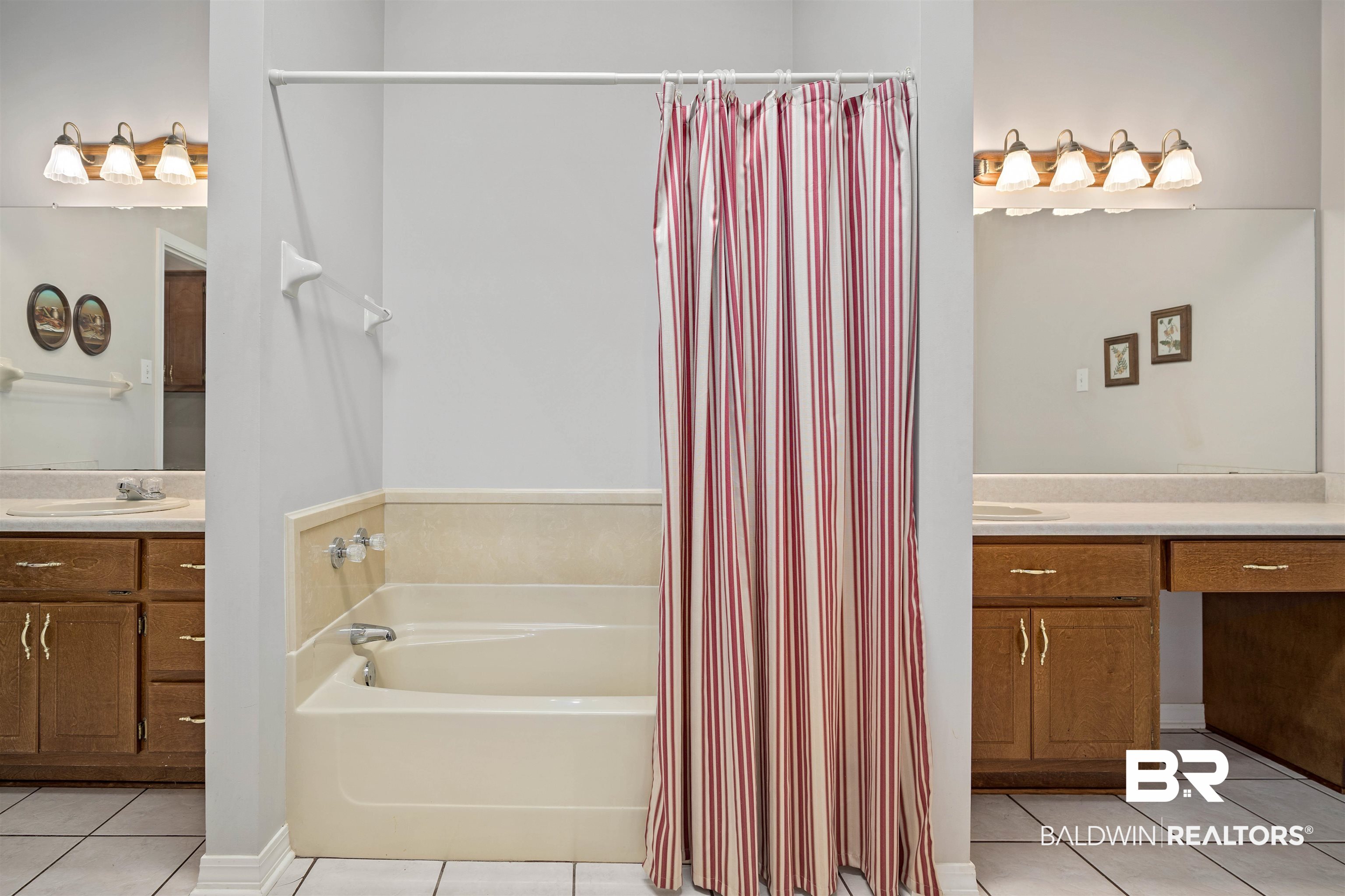 7419 Pake Road Saraland, AL 36571 - Photo 15 of 27 Bathroom featuring tile patterned flooring, a bath, and vanity