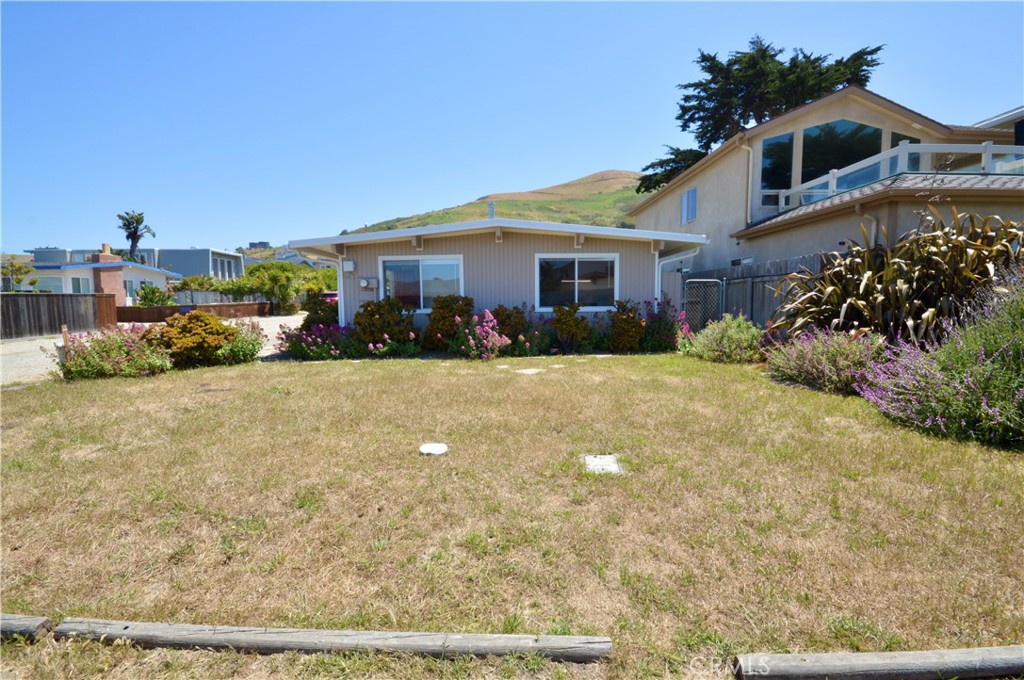 3175 Studio Drive Cayucos, CA 93430 - Photo 16 of 20 a view of a house with a yard
