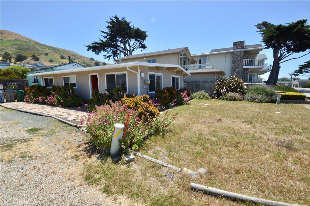 3175 Studio Drive Cayucos, CA 93430 - Photo 17 of 20 a front view of a house with a yard