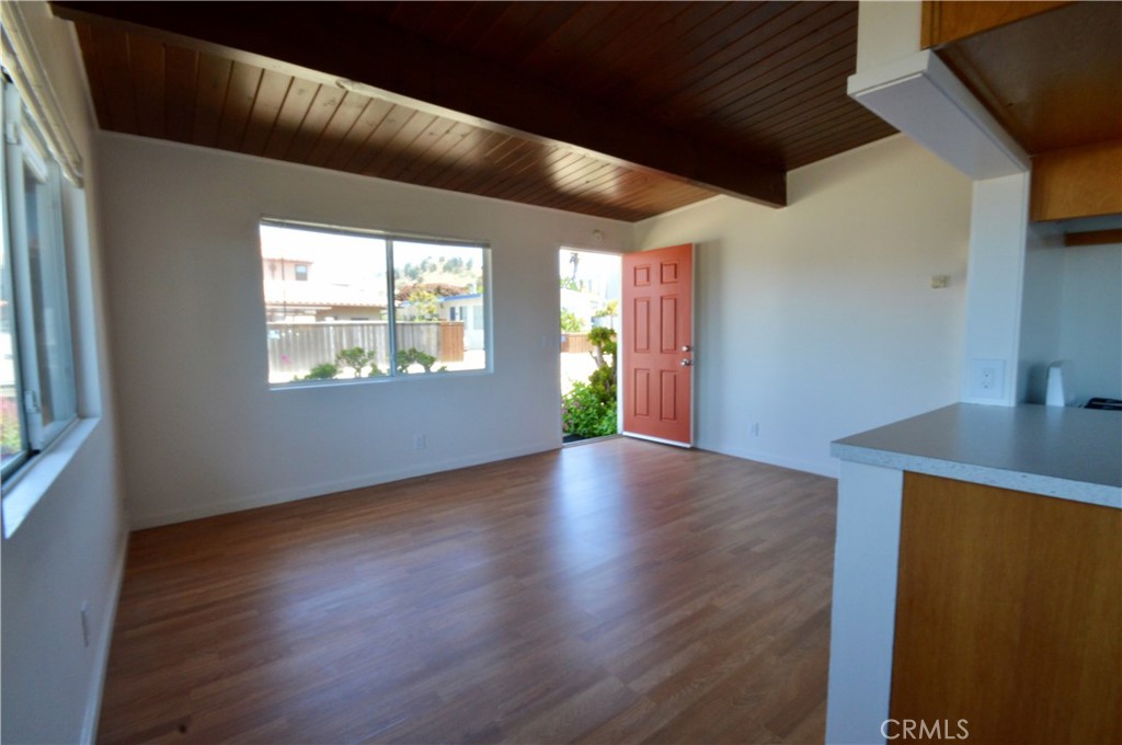 3175 Studio Drive Cayucos, CA 93430 - Photo 7 of 20 a view of an empty room with wooden floor and a window