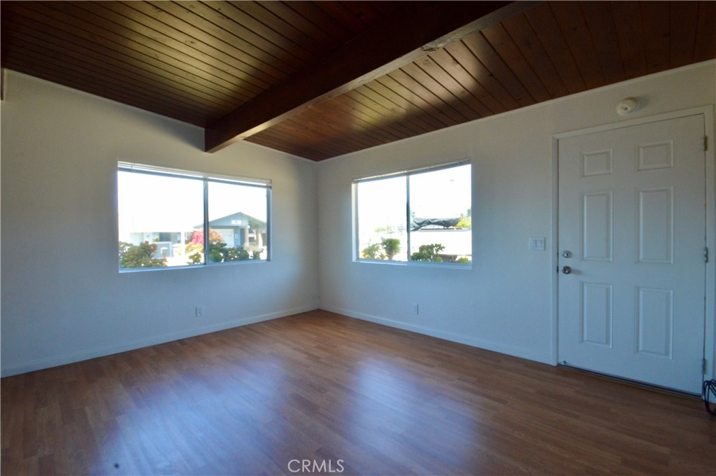 3175 Studio Drive Cayucos, CA 93430 - Photo 8 of 20 a view of an empty room with wooden floor and a window