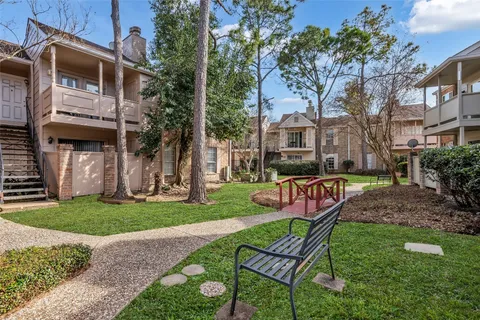 a view of a patio with a yard