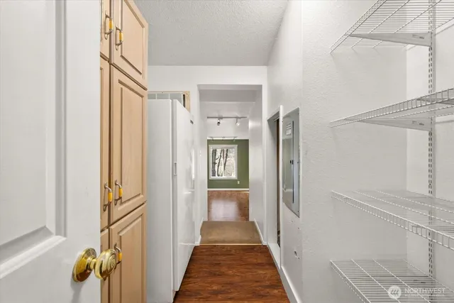 a view of a hallway view with wooden floor and staircase