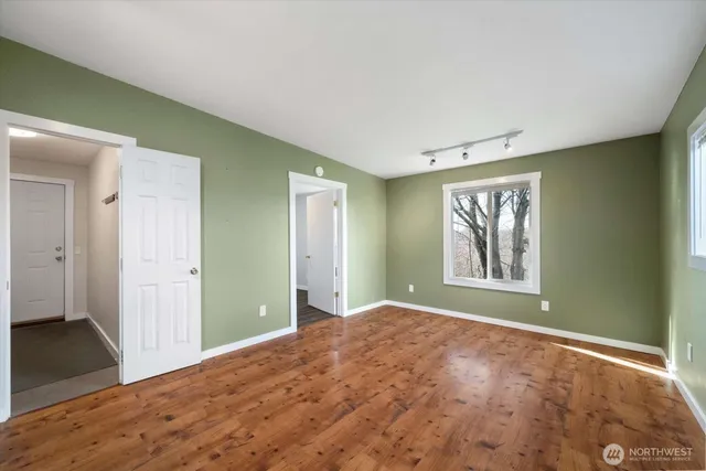 a view of a room that has a window in it