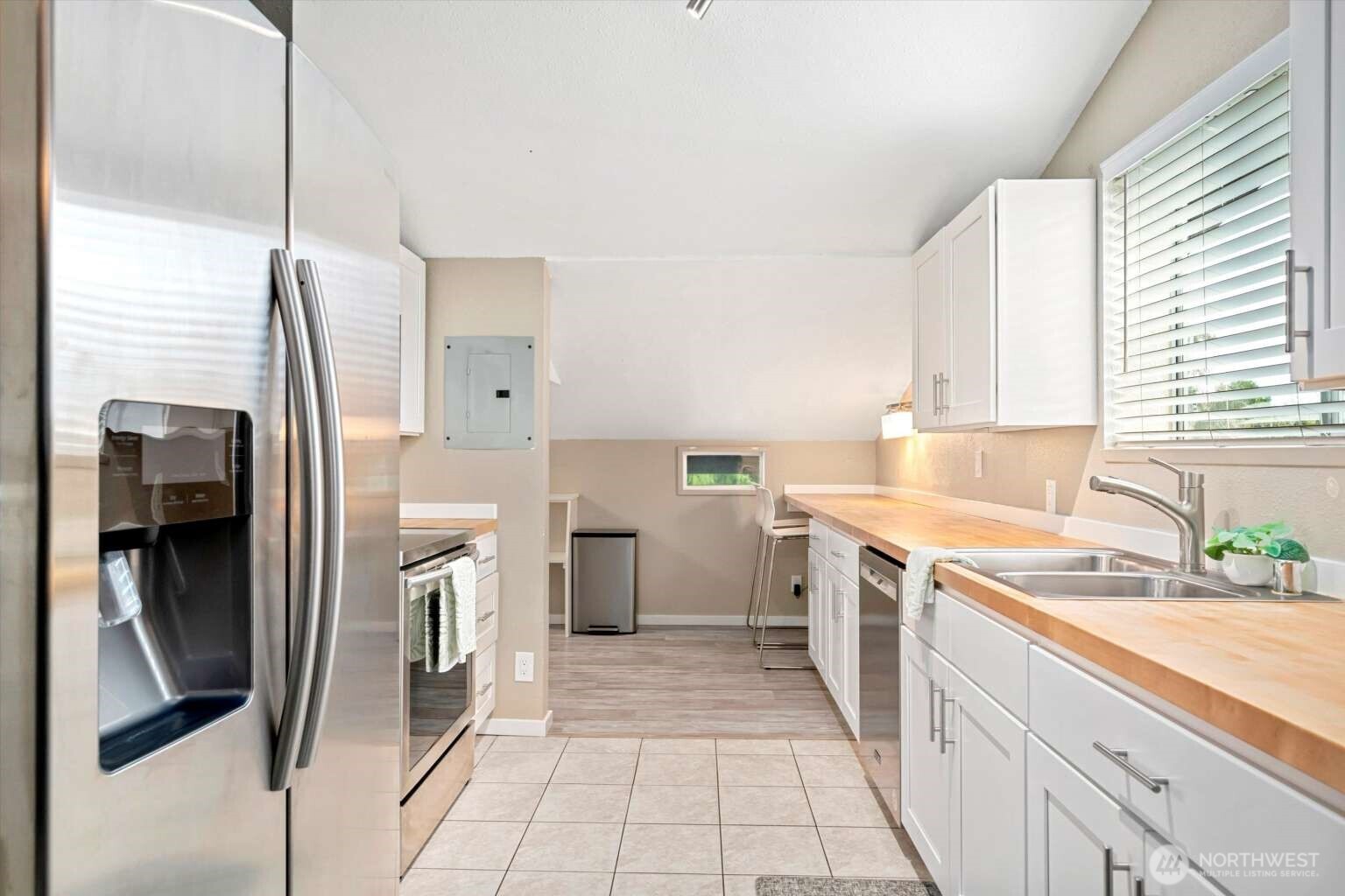 4241 Rural Avenue Bellingham, WA 98226 - Photo 29 of 40 a kitchen with a sink stove and refrigerator