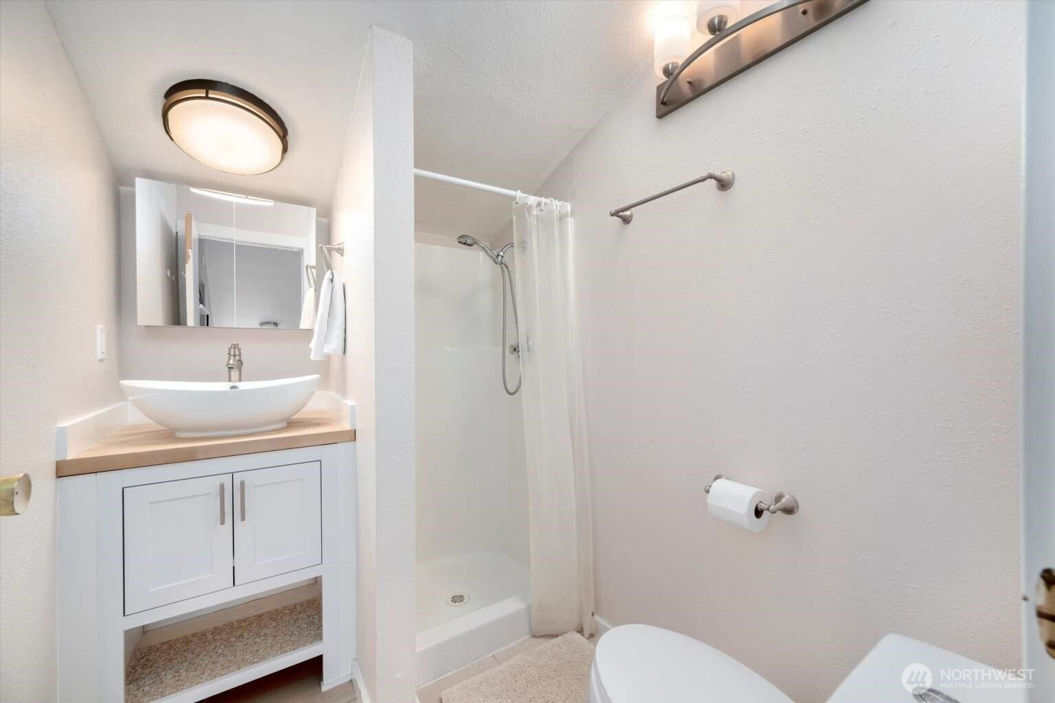 4241 Rural Avenue Bellingham, WA 98226 - Photo 30 of 40 a bathroom with a sink a toilet and shower