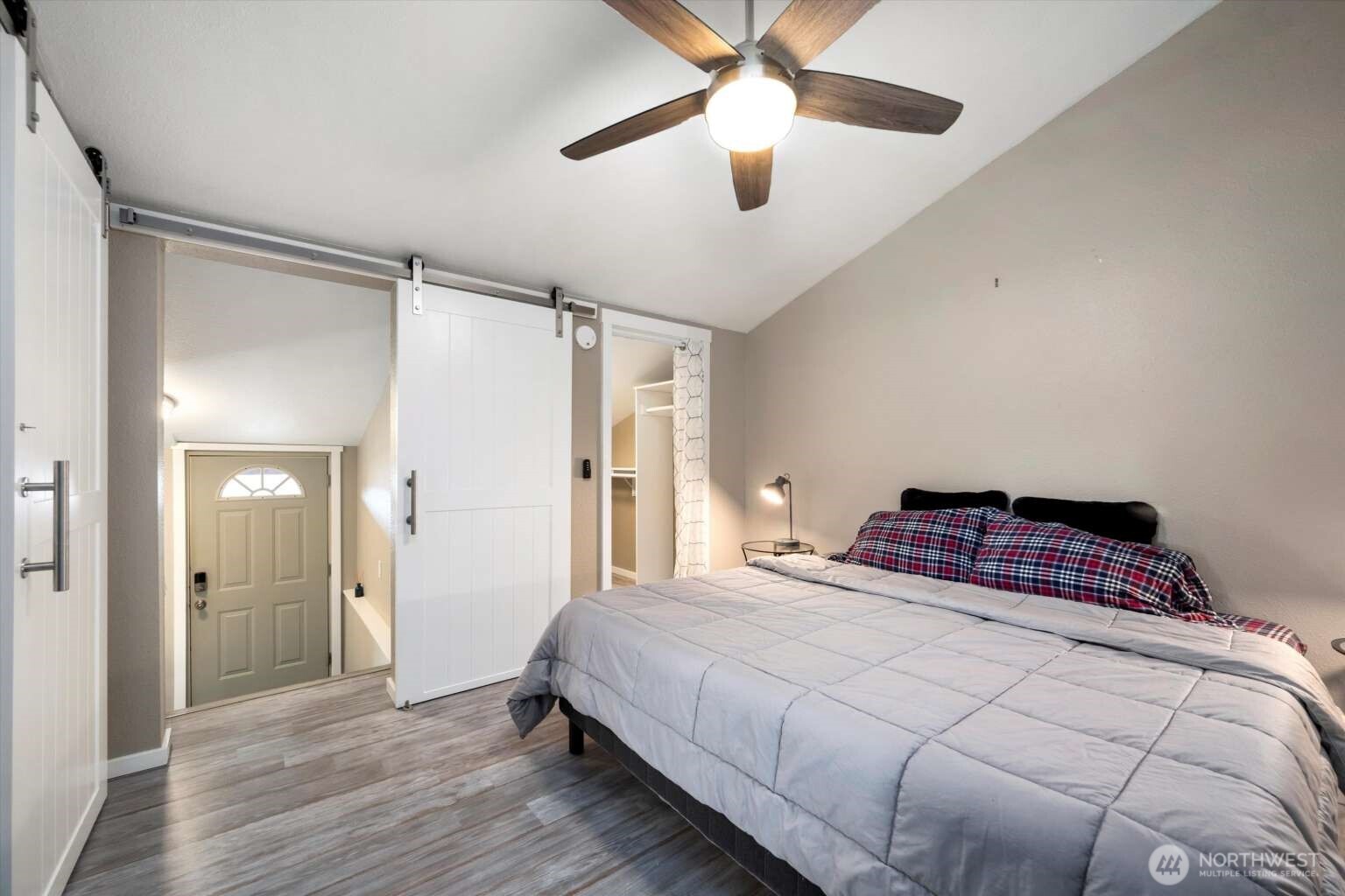 4241 Rural Avenue Bellingham, WA 98226 - Photo 31 of 40 a bedroom with a bed and a chandelier