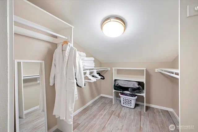 a bed room with a bed and a chair