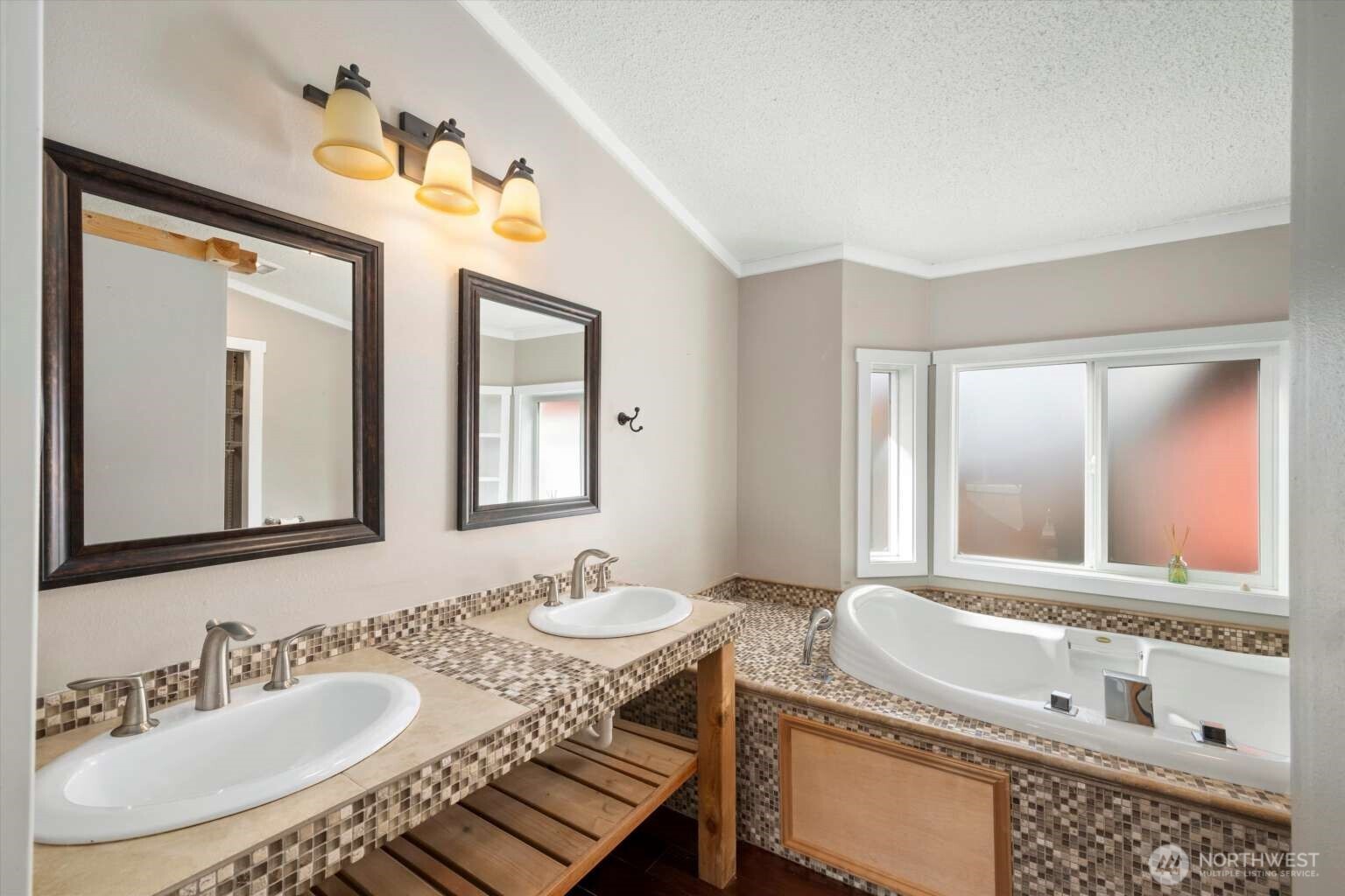 4241 Rural Avenue Bellingham, WA 98226 - Photo 10 of 40 a bathroom with a granite countertop sink and a mirror