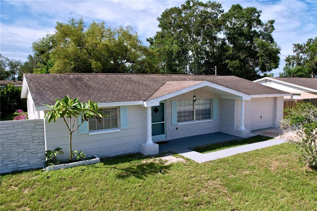 a backyard of a house with lots of green space