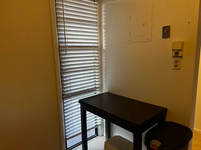 a view of a bathroom with a sink and a window