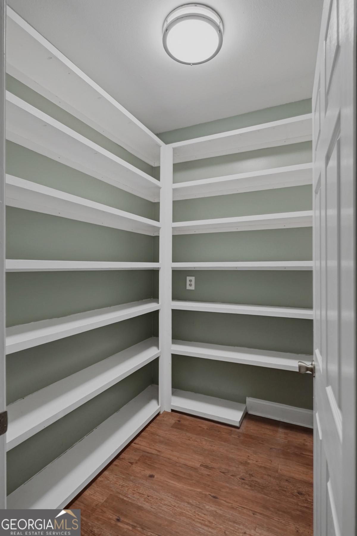 609 Morgan Street Albany, GA 31705 - Photo 16 of 74 a view of walk in closet with empty racks