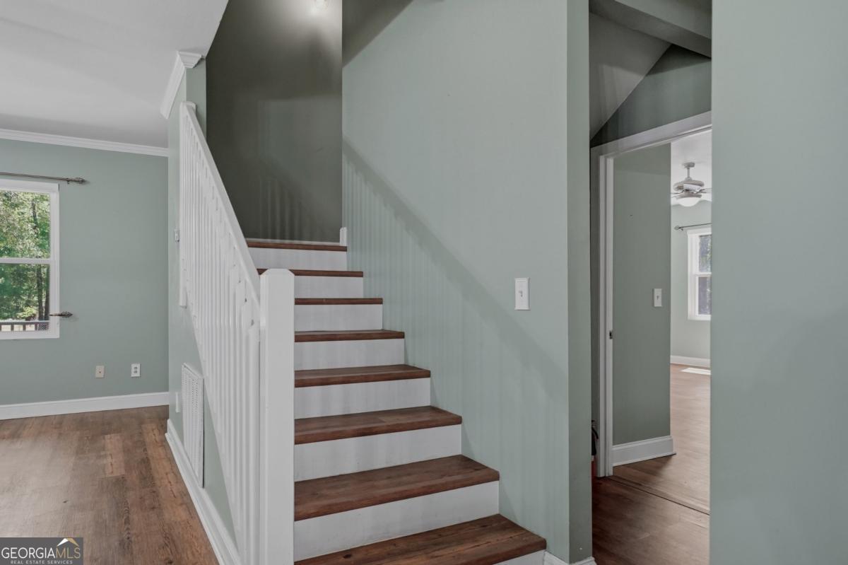 609 Morgan Street Albany, GA 31705 - Photo 28 of 74 a view of entryway with wooden floor and stairs