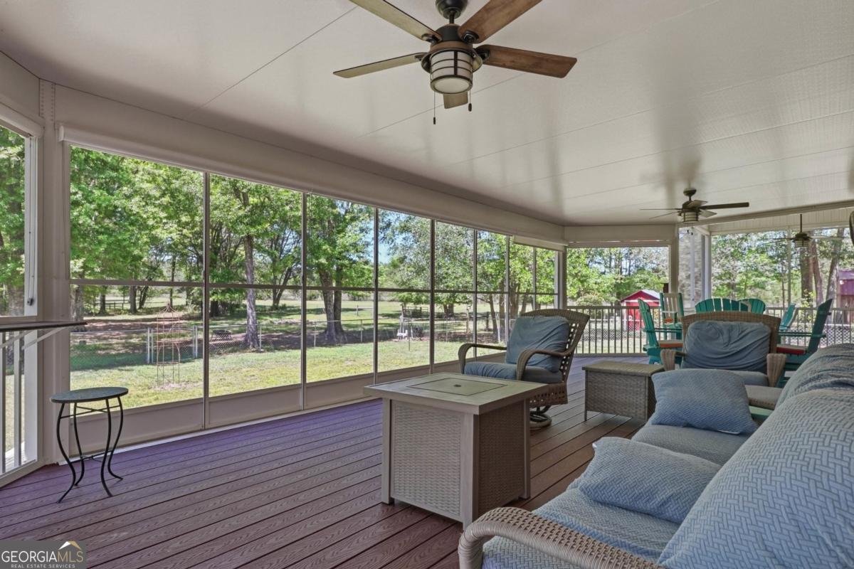 609 Morgan Street Albany, GA 31705 - Photo 39 of 74 a living room with furniture and a floor to ceiling window