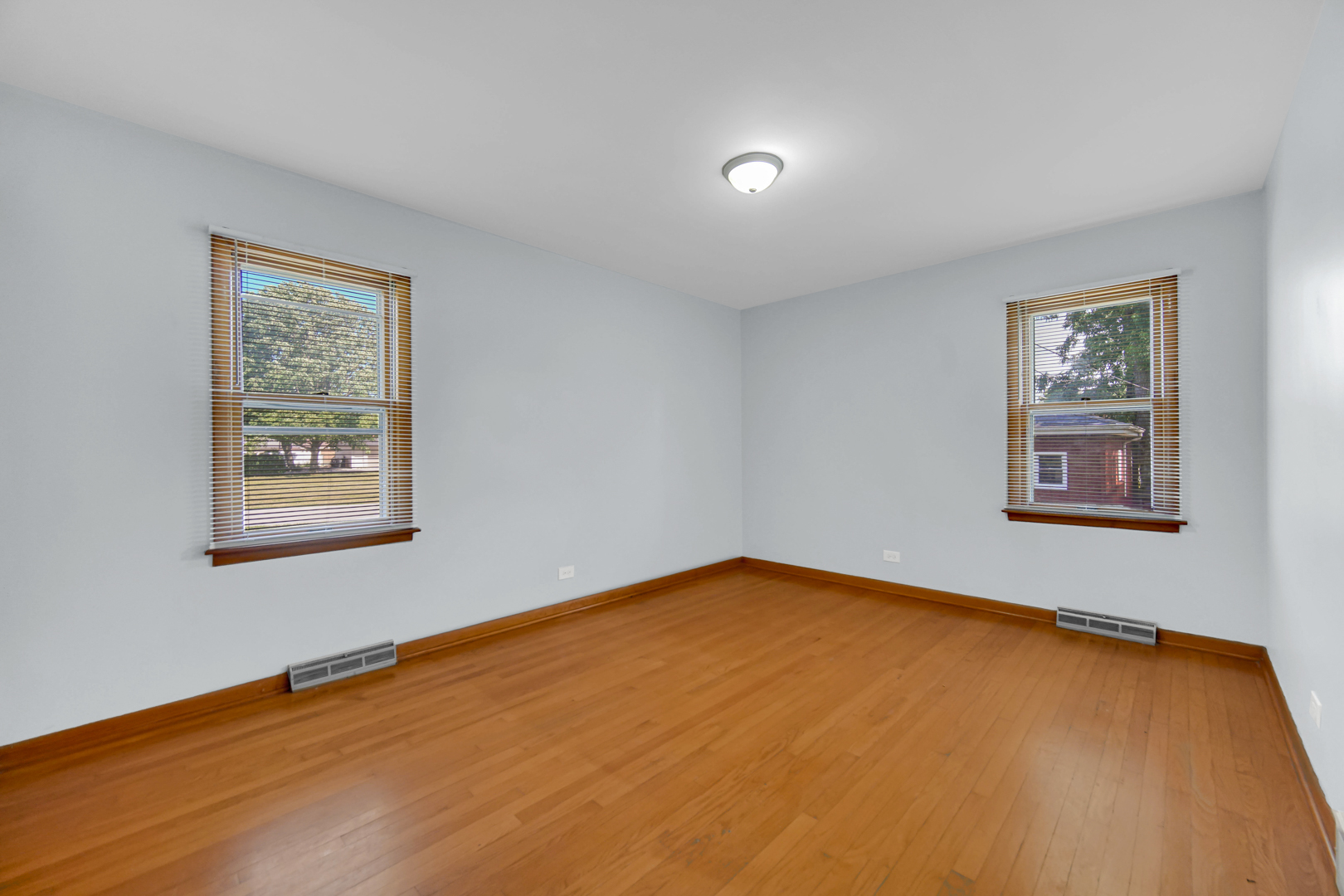 2621 Ridge Road Lansing, IL 60438 - Photo 14 of 20 a view of a room with a wooden floor and a window