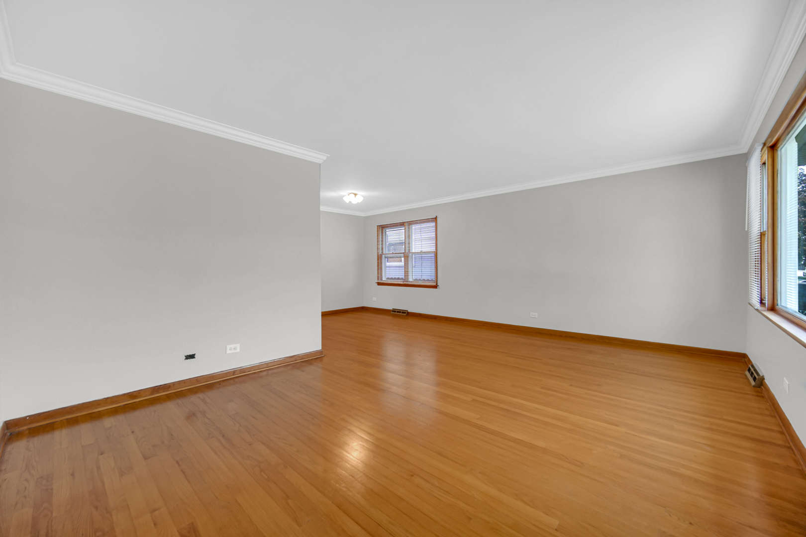 2621 Ridge Road Lansing, IL 60438 - Photo 2 of 20 a view of empty room with wooden floor and fan