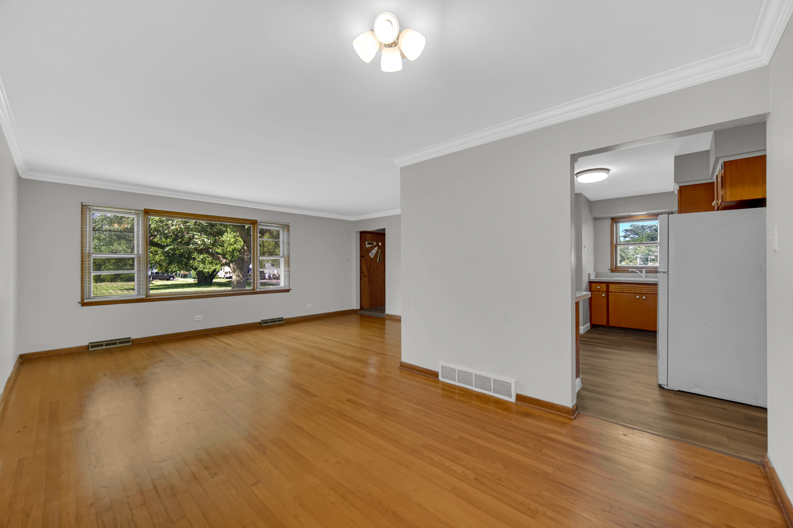 2621 Ridge Road Lansing, IL 60438 - Photo 4 of 20 wooden floor in an empty room with a window