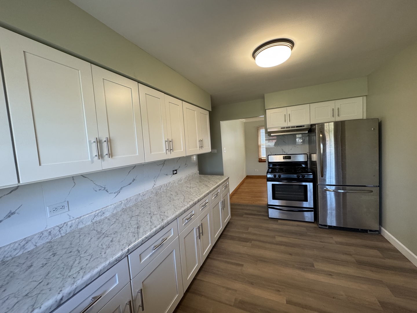 2621 Ridge Road Lansing, IL 60438 - Photo 7 of 20 a kitchen with stainless steel appliances granite countertop a refrigerator and a stove