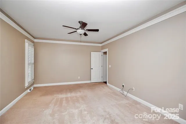 a view of a big room with carpet