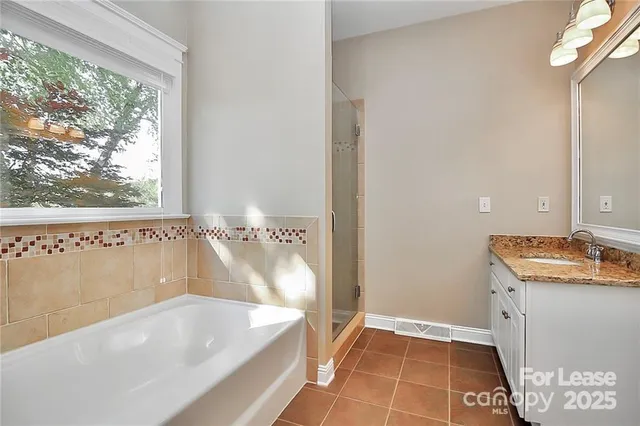 a bath tub sitting next to a window
