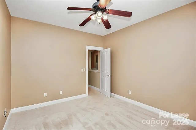 a view of a chandelier fan in a room