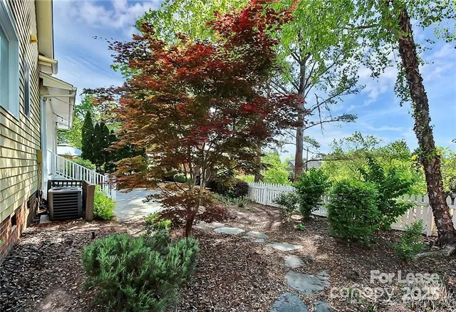 a backyard of a house with lots of green space