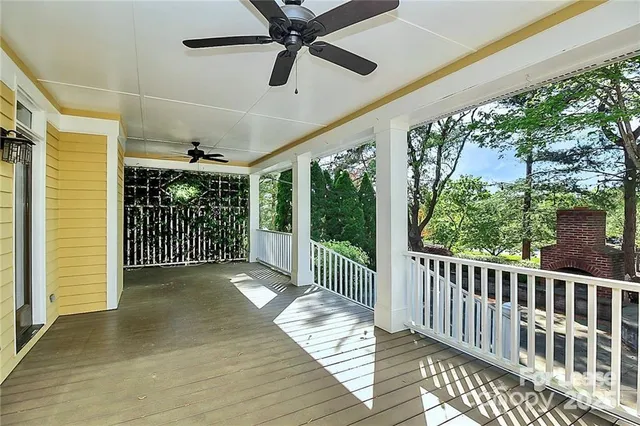 a view of a balcony with wooden floor