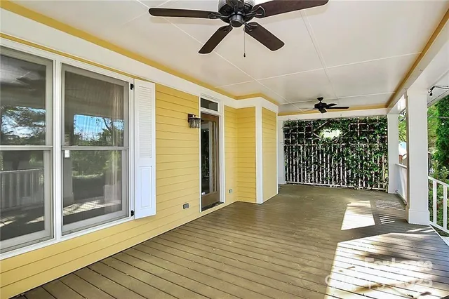 a view of a room with wooden floor and balcony