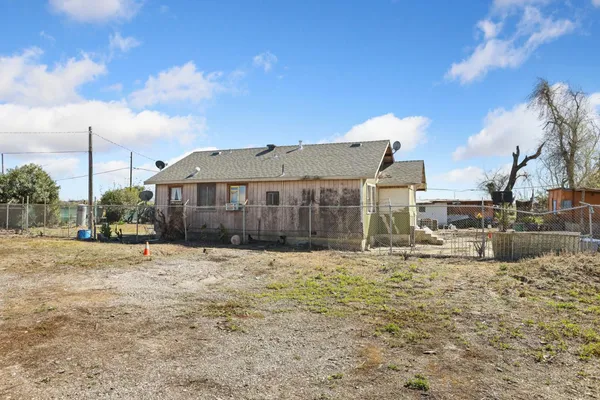 a view of a house with a snow in the yard
