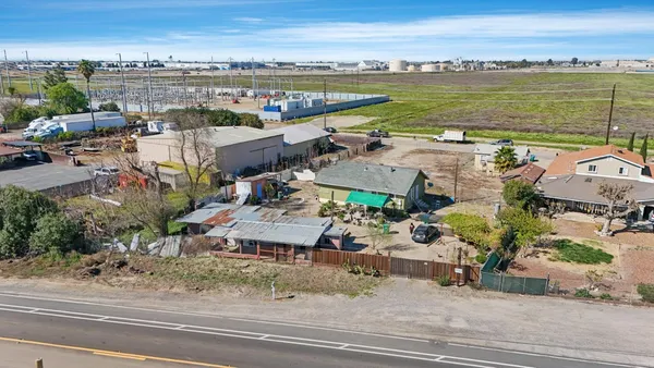 an aerial view of a house with a ocean view