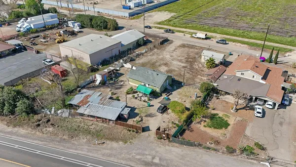 an aerial view of a house with outdoor space