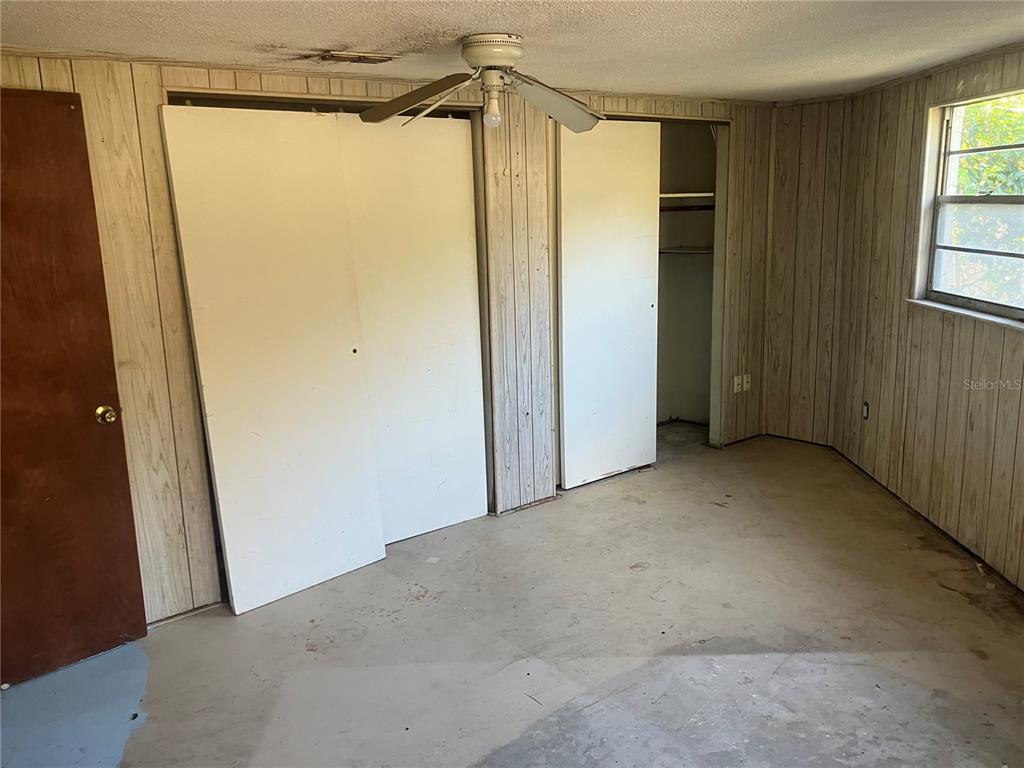 8428 Anay Court New Port Richey, FL 34653 - Photo 13 of 31 a view of a room with a glass door