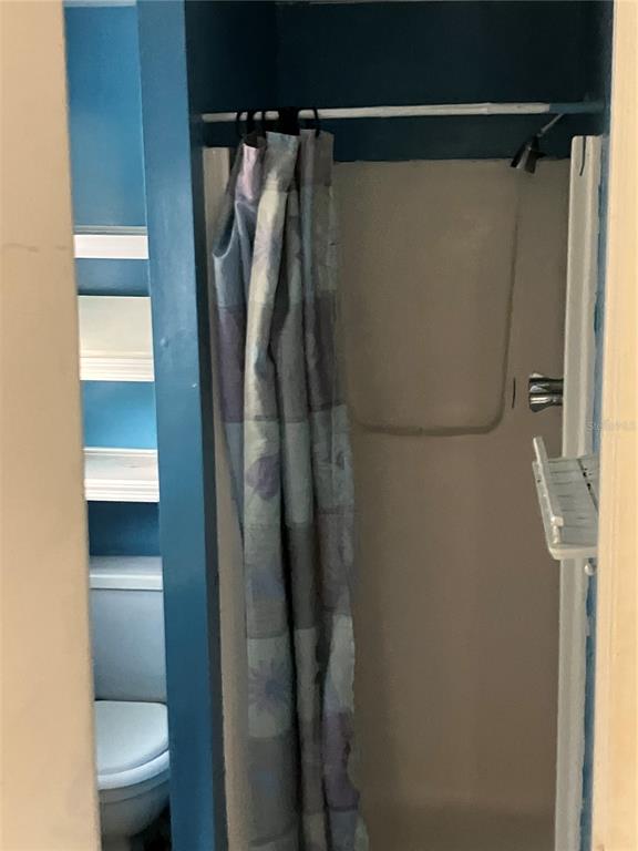 8428 Anay Court New Port Richey, FL 34653 - Photo 21 of 31 a bathroom with a shower and a toilet