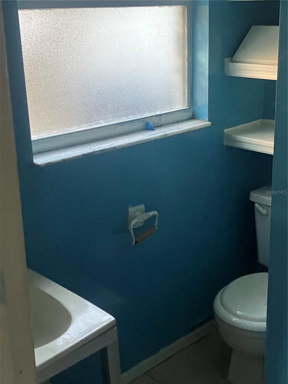 8428 Anay Court New Port Richey, FL 34653 - Photo 22 of 31 a bathroom with a toilet