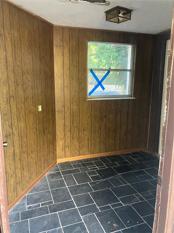8428 Anay Court New Port Richey, FL 34653 - Photo 4 of 31 a view of an empty room with a window