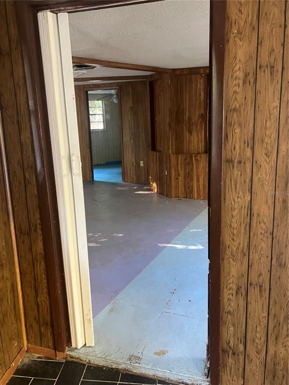 8428 Anay Court New Port Richey, FL 34653 - Photo 5 of 31 an entryway view with wooden floor