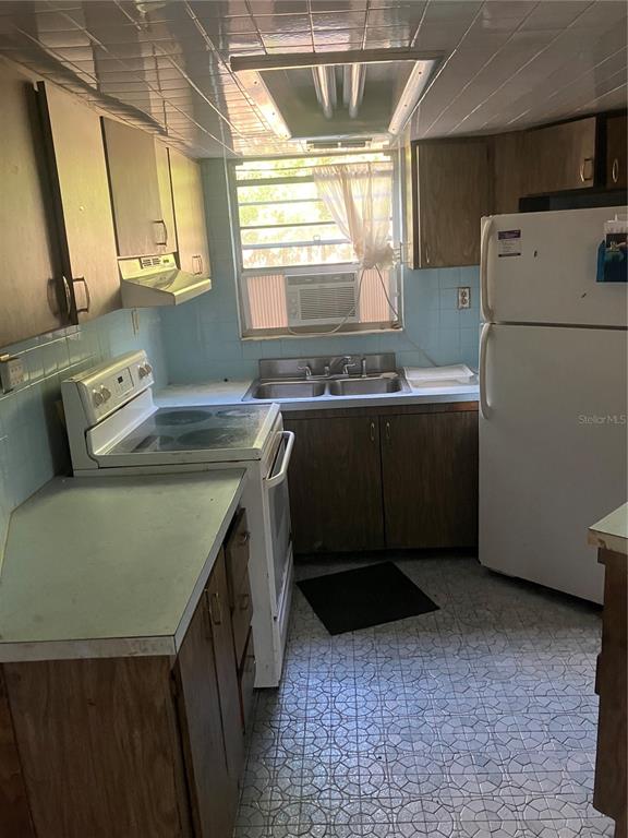 8428 Anay Court New Port Richey, FL 34653 - Photo 9 of 31 a room with storage and utility