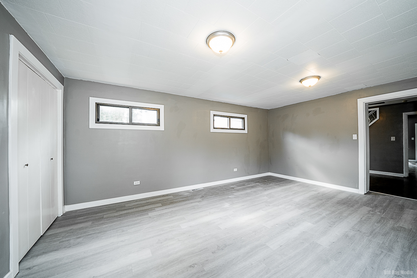 11 167th Street Calumet City, IL 60409 - Photo 11 of 20 a view of an empty room with wooden floor and a window