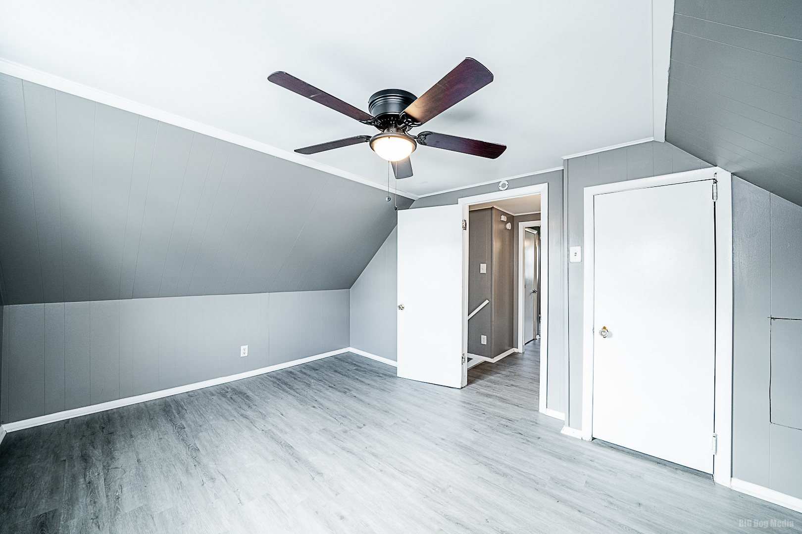 11 167th Street Calumet City, IL 60409 - Photo 13 of 20 a view of a room with wooden floor and a ceiling fan