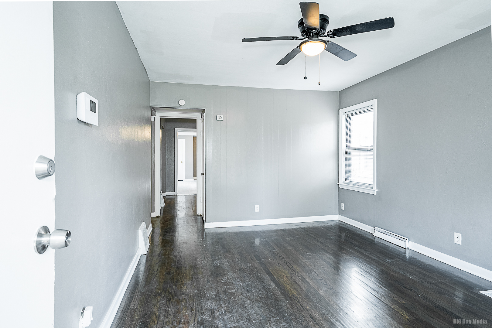 11 167th Street Calumet City, IL 60409 - Photo 4 of 20 wooden floor in an empty room with a window